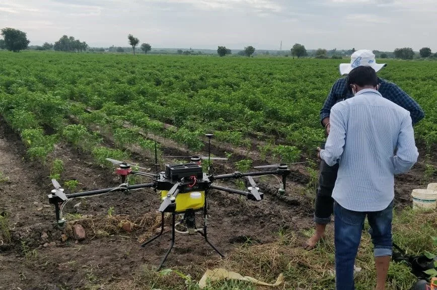 Agricultural field with mechanized spraying equipment